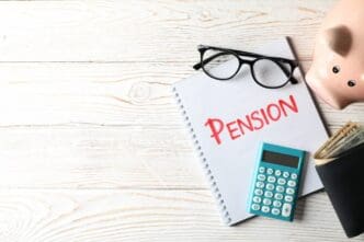 A wooden surface displays the word "Pension."