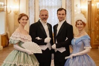 People dressed in historical costumes pose for a photograph.