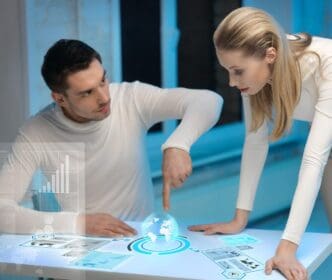 A man and a woman collaborate, interacting with multiple virtual screens displayed in front of them.