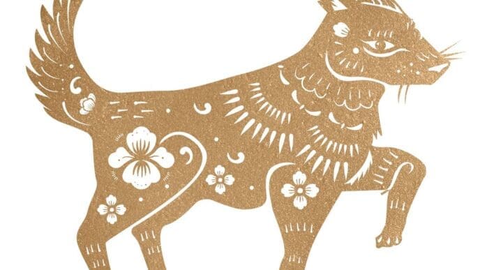 Illustration of a golden dog, representing the Chinese zodiac sign, against a white background.