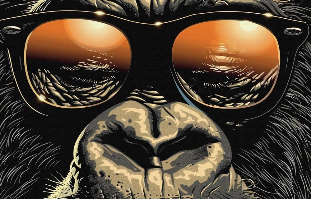 A movie poster shows a cartoon monster wearing glasses.