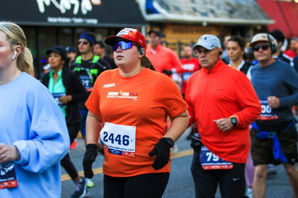 Runners gather at the starting line of a half marathon, ready to begin the race.