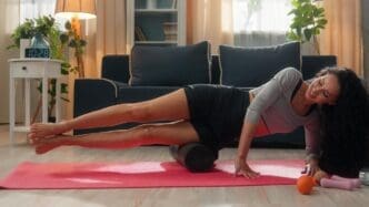 A young Hispanic Arab woman exercises on a foam mat.