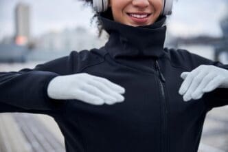 A person with their hands raised in front of their chest.
