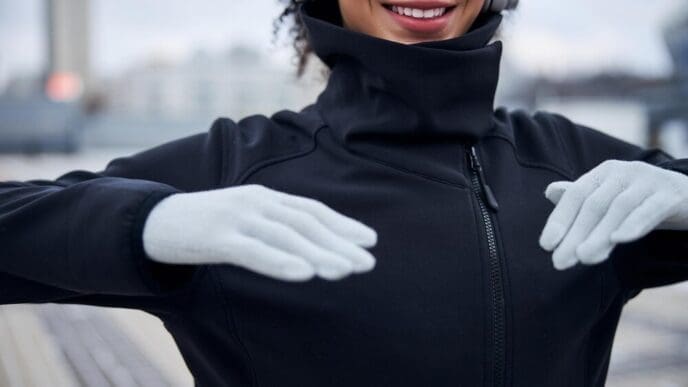 A person with their hands raised in front of their chest.
