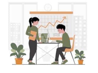 A team of diverse people collaborates around a table in a modern co-working space.