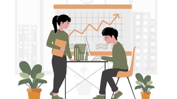 A team of diverse people collaborates around a table in a modern co-working space.