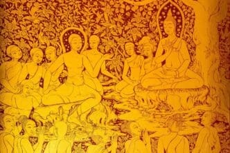 A yellow painting is displayed at a tilt on a wall.