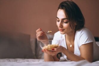 A woman is shown eating cereal.