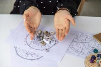 A woman, presumably a numerologist and astrologer, counts numbers, with a selective focus on her hands or the numbers.