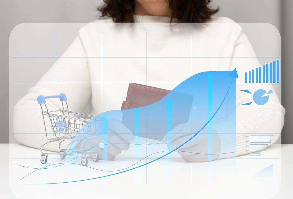 A woman sits at a table, holding a leather wallet in front of a holographic graph with growing indicators.