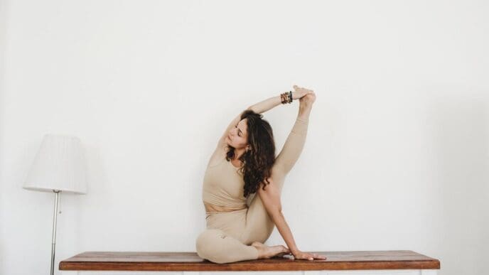 A young girl demonstrates flexibility while doing yoga and gymnastics.