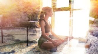 A young girl in a yoga pose is superimposed over a tranquil zen garden.
