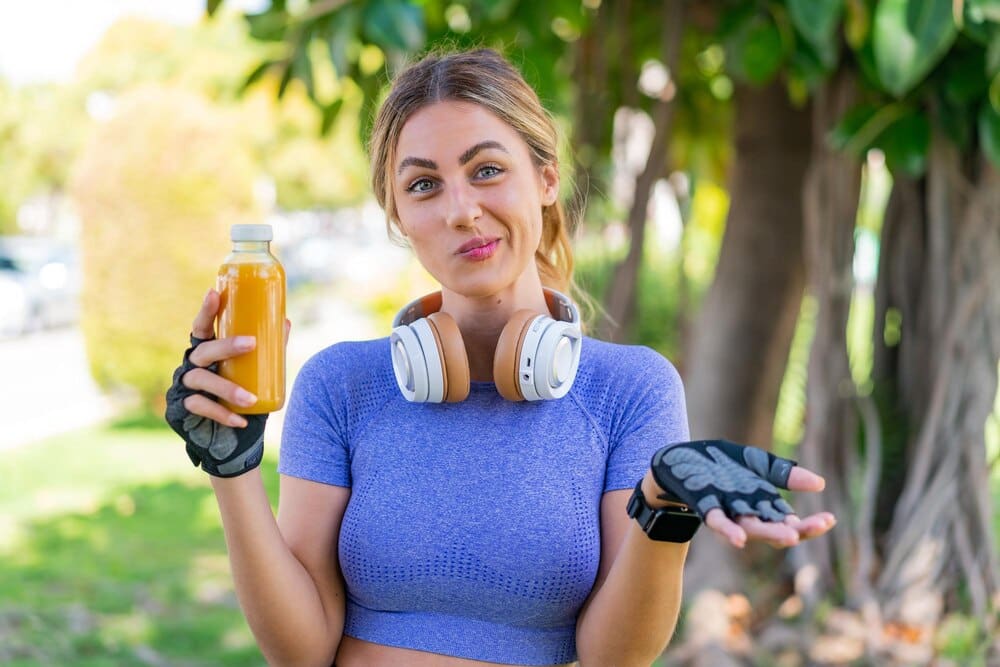 A young, attractive woman with blonde hair is smiling.