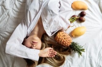 A young woman is lying on a bed.