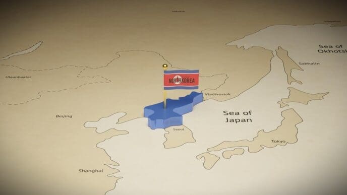 A 3D digital render of a map of East Asia, with a large, extruded blue shape marking North Korea and a pin with the North Korean flag placed on it.