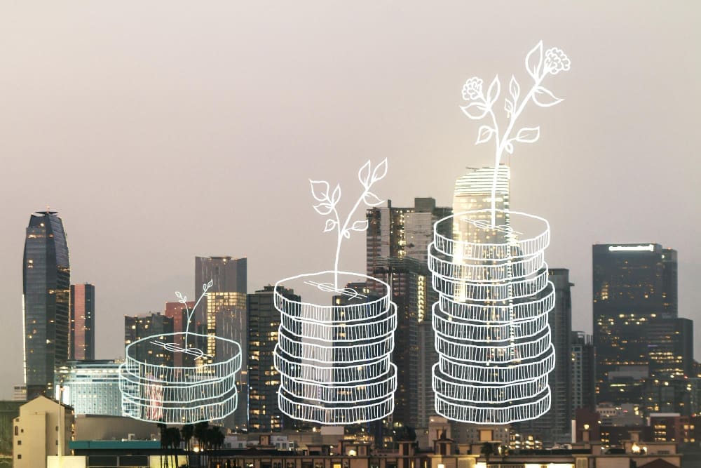 An illustration of three stacks of coins with plants growing from the top, set against a cityscape at night.