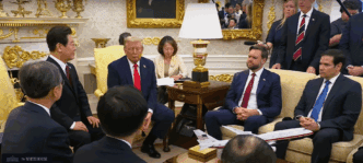 President Donald Trump and the President of the Republic of Korea are seated in a formal room, surrounded by their delegations during a bilateral meeting.