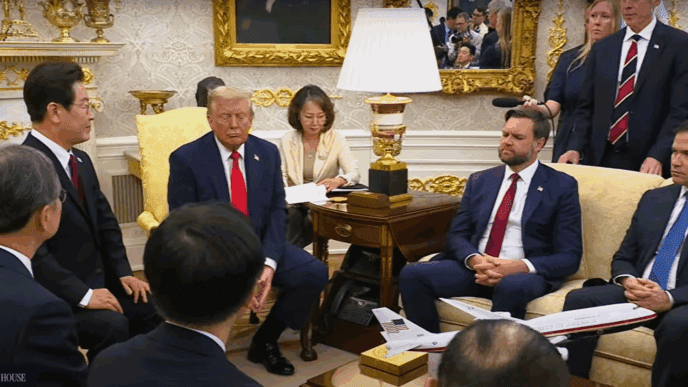 President Donald Trump and the President of the Republic of Korea are seated in a formal room, surrounded by their delegations during a bilateral meeting.