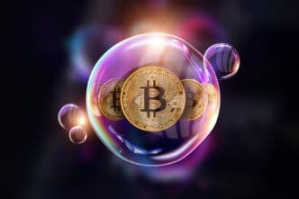 A conceptual 3D render of a large, colorful, iridescent bubble with several golden Bitcoin coins trapped inside it, floating against a dark background.