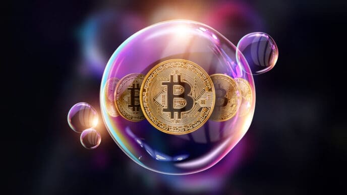 A conceptual 3D render of a large, colorful, iridescent bubble with several golden Bitcoin coins trapped inside it, floating against a dark background.