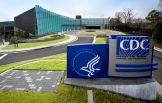 The entrance to the Tom Harkin Global Communications Center with a large sign for the CDC
