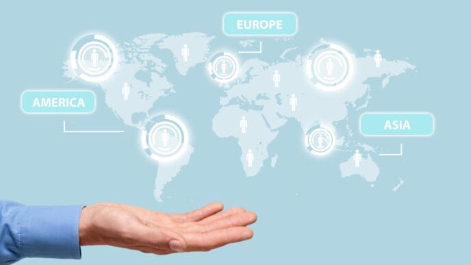 A hand holds up a glowing world map with labels for America, Europe, and Asia, and icons representing people on each continent.
