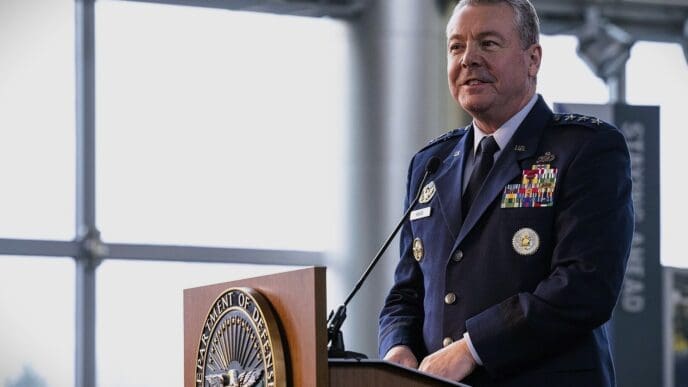 Lieutenant General Jeffrey A. Kruse in uniform stands at a podium with the Department of Defense seal.