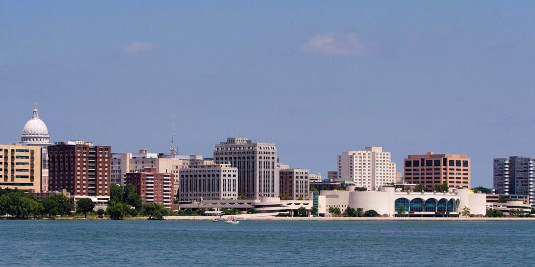 The Madison, Wisconsin skyline and its Capitol building are visible from across Lake Monona