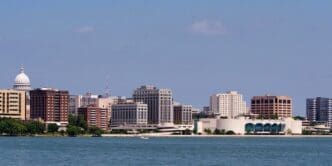 The Madison, Wisconsin skyline and its Capitol building are visible from across Lake Monona