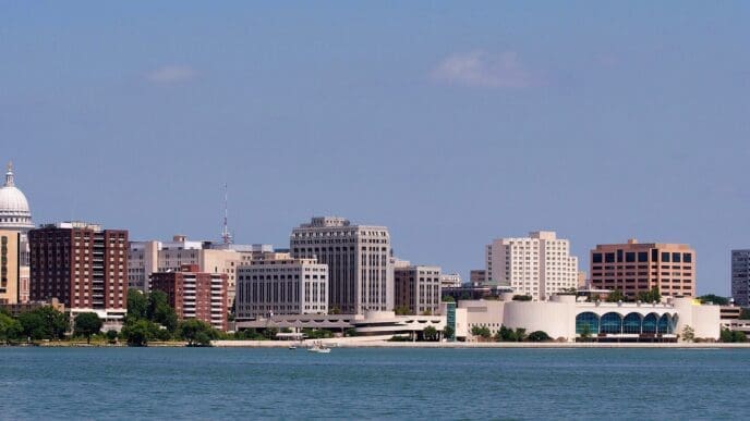 The Madison, Wisconsin skyline and its Capitol building are visible from across Lake Monona