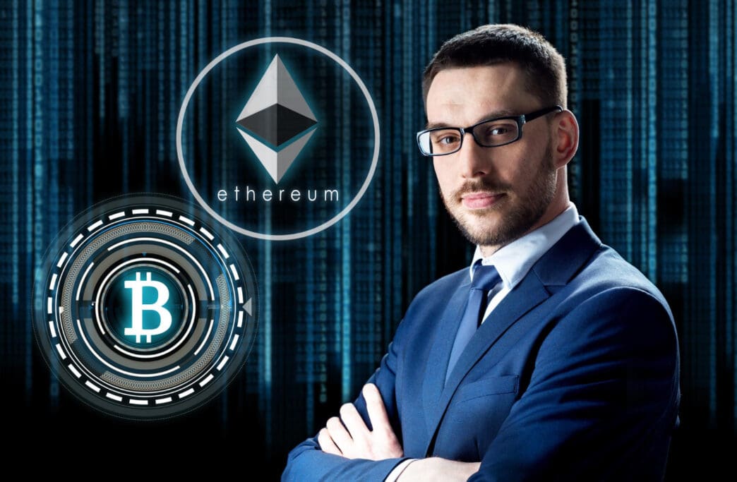 A professional man in a suit stands confidently with his arms crossed, with large, glowing digital symbols for Ethereum and Bitcoin floating beside him against a blue data background.