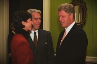 A professional photograph of Bill Clinton, Jeffrey Epstein, and Ghislaine Maxwell standing together and talking at a formal event.