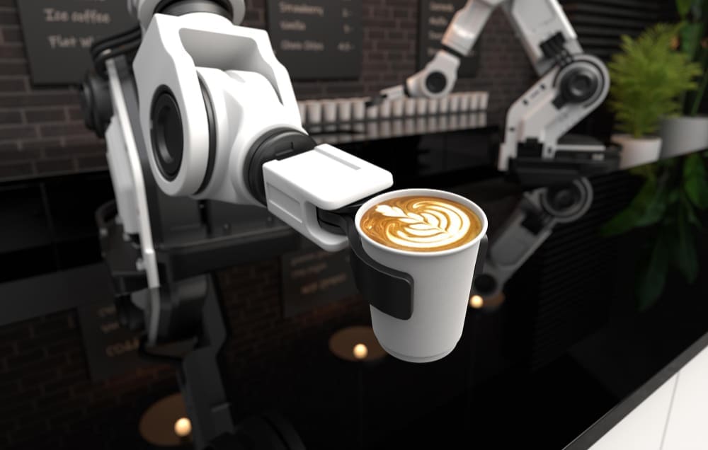 A robotic arm in a futuristic cafe is holding a coffee cup with a latte art design on top.