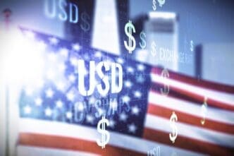 A conceptual image featuring a blurry American flag with the word "USD" and several floating dollar signs overlaid on top, in front of a hazy city skyline.