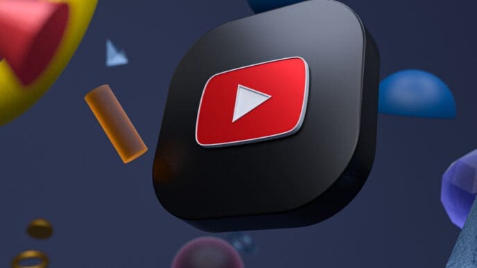 A three-dimensional rendering of the YouTube logo with a black background and floating geometric shapes