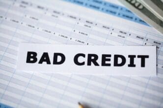 "A white sheet of paper displays the words 'Bad Credit' in black text."