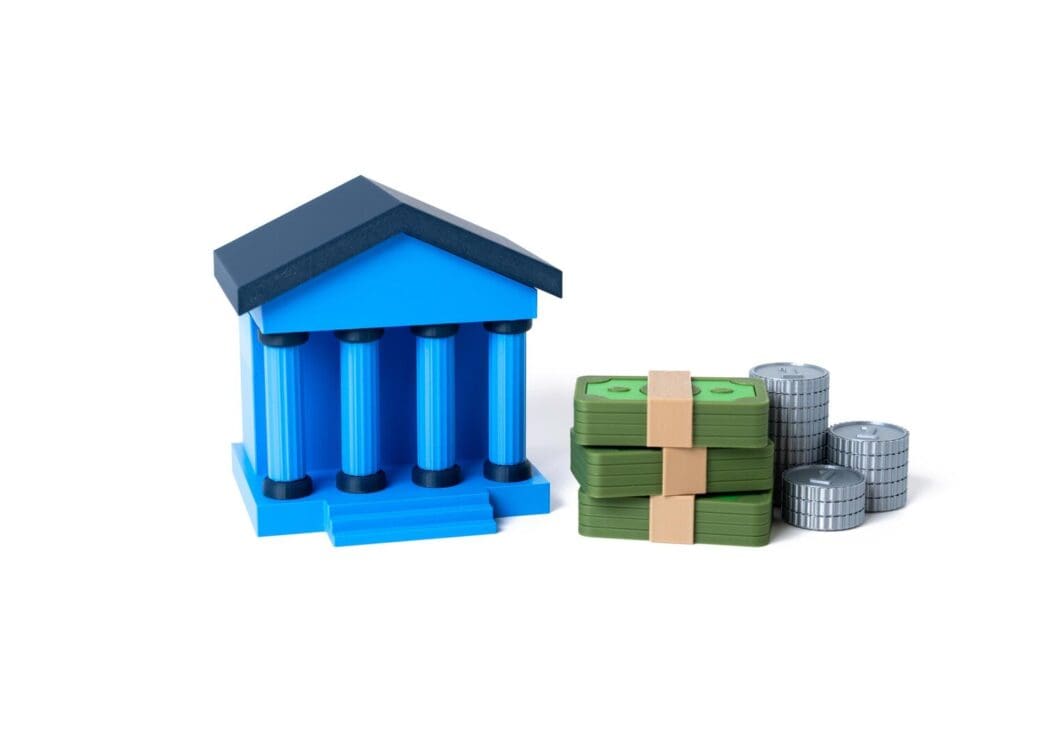 A stack of gold coins represents financial stability and banking services.