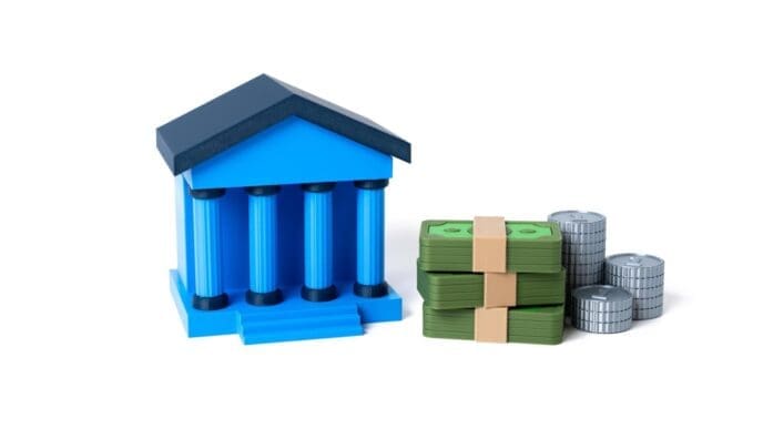 A stack of gold coins represents financial stability and banking services.