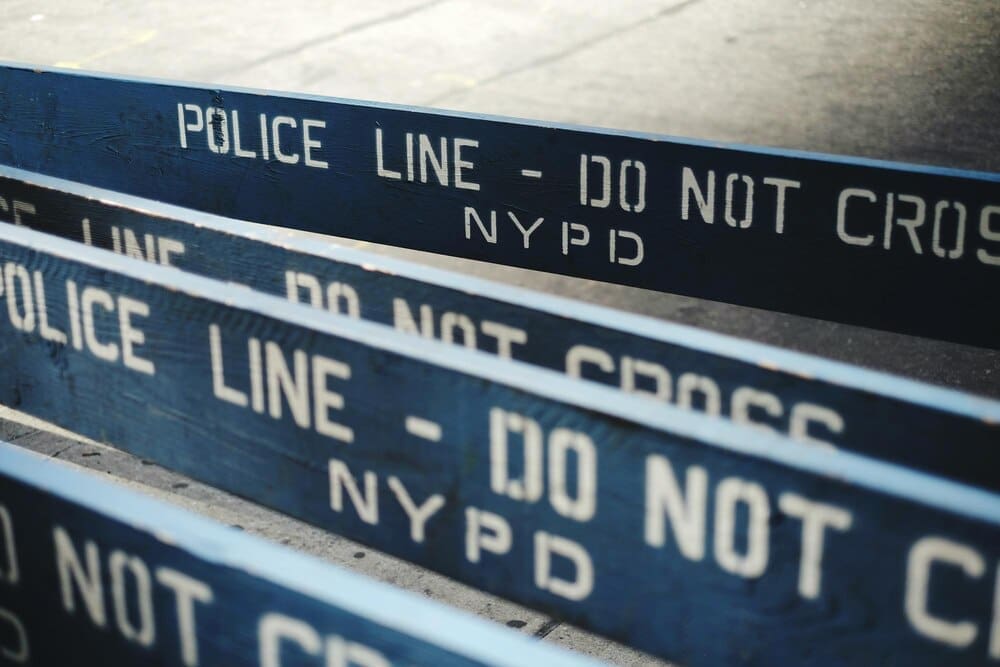 Barricades with text are set up on a street.