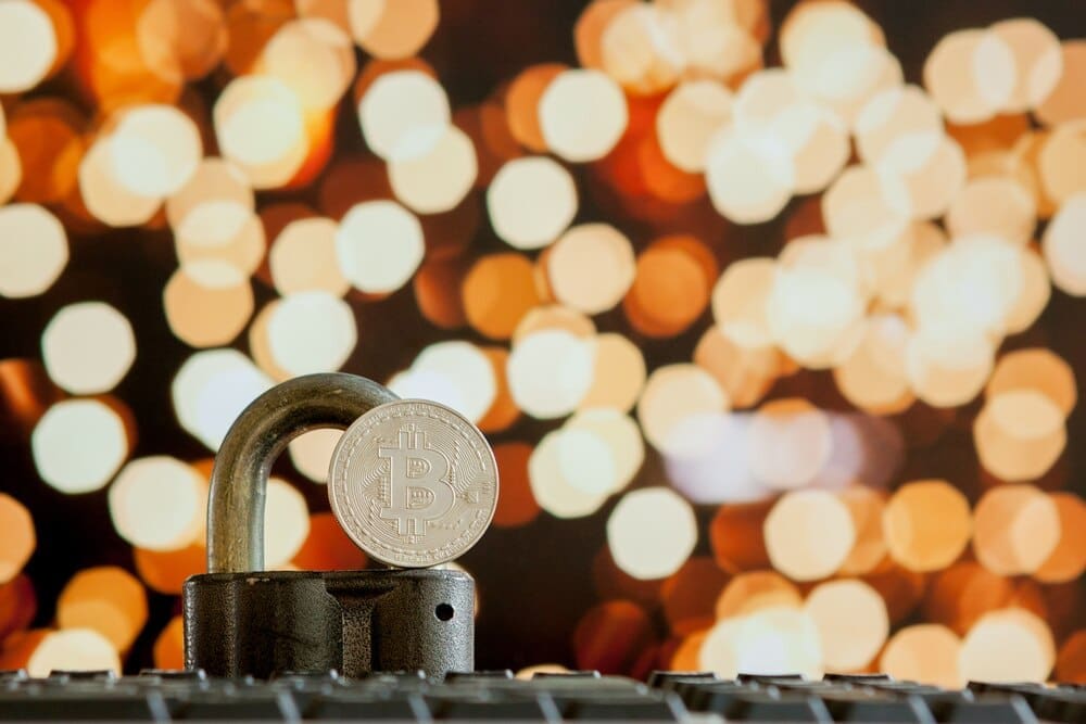 Close-up of a computer keyboard with a Bitcoin symbol displayed on the keys.