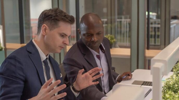 Diverse colleagues collaborate in a modern office setting.