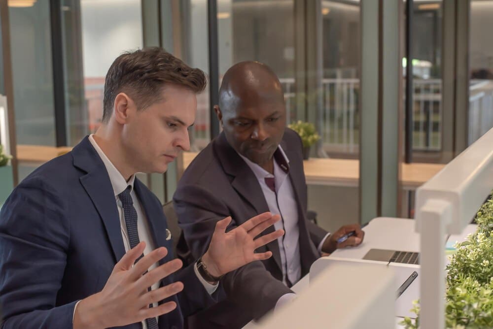 Diverse colleagues collaborate in a modern office setting.