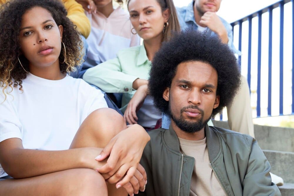 Close-up portrait of several young people of mixed race.