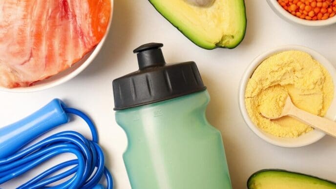 Top-down view of sports nutrition concept, possibly depicting various supplements and healthy food items.