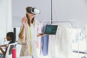 A costume designer uses virtual reality technology to digitally design clothing in a tailor studio.