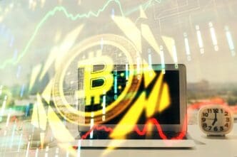 Hologram of blockchain and crypto economy themes superimposed over a table with a computer in the background, representing the concept of Bitcoin cryptocurrency.