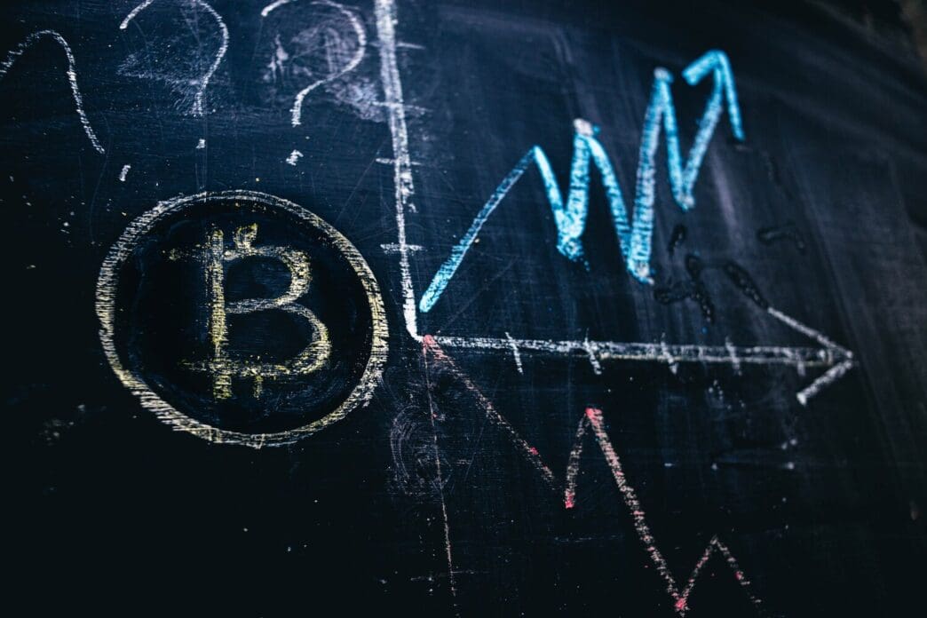 Chalkboard drawing illustrating the fluctuating price of Bitcoin cryptocurrency.