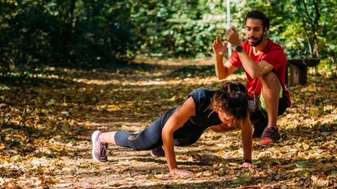 A person is exercising outdoors in a park.