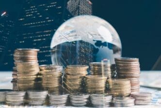 Double exposure of a financial chart and rows of coins, representing investment and business growth.